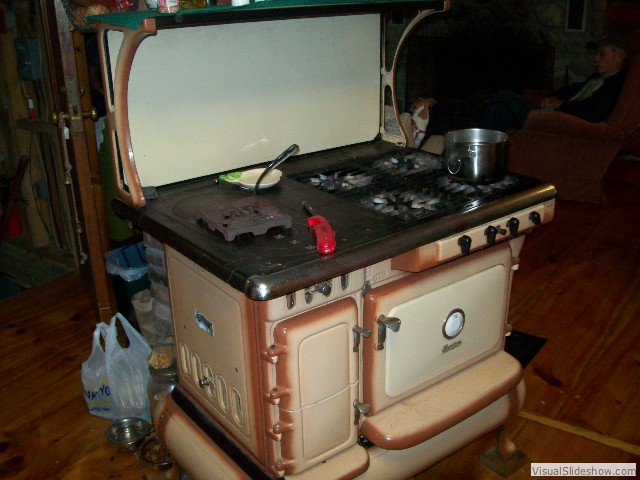 with combination antique propane and wood cook stove - in great working condition